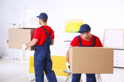 Removal team loading boxes and furniture for a move in Bickley