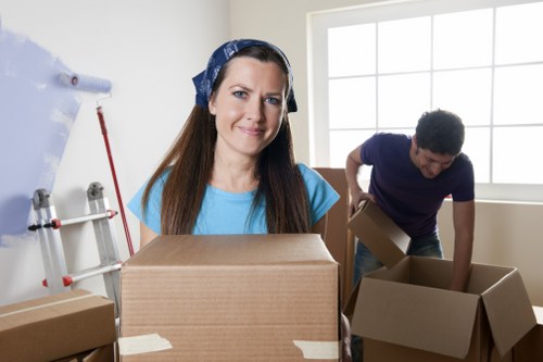 Moving van and packed boxes representing a booked man and van service