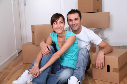 Furniture being carried safely down stairs during a flat removal
